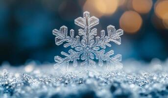 A snowflake is sitting on top of a snow covered ground. The snowflake is very clear and has a very sharp point photo