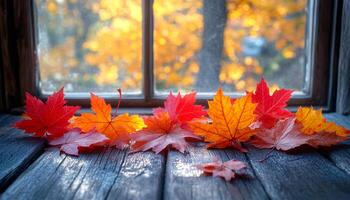 A window view of autumn leaves on a wooden table. The leaves are red and yellow, and they are scattered across the table. Scene is peaceful and serene, as the leaves are falling gently photo