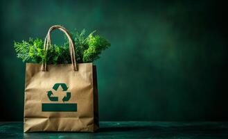 A brown bag with a green plant inside and the word recycle on it photo