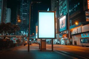 A bright, blank billboard stands in a bustling city at night, surrounded by vibrant lights and tall buildings, creating a captivating backdrop for future advertising and promotions photo