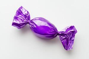 This shiny and vibrant purple candy, elegantly wrapped in foil, features a simple yet charming design that perfectly enhances sweet treats and creates attractive displays at any type of celebration photo