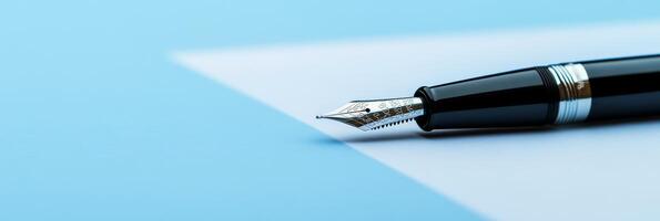 An elegant fountain pen elegantly rests upon premium quality paper, symbolizing the essence of inspiration and creativity that is essential in effective business planning and notetaking processes photo