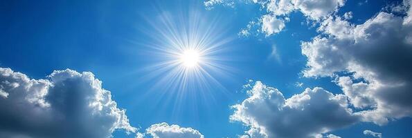 A serene and picturesque view of a bright blue sky that is filled with fluffy white clouds and shimmering radiant sunlight, perfectly embodying peace and beautiful harmony found in nature photo