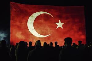 A diverse crowd gathers under the Turkish flag, joyfully celebrating Turkeys rich culture with music, dance, and colorful displays during this unforgettable night of festivities and unity photo