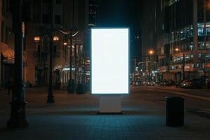 A large, blank LED billboard stands prominently in a bustling city at night, surrounded by beautifully illuminated buildings, creating a serene urban atmosphere amidst the lively city environment photo