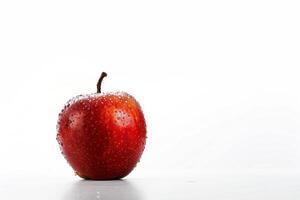 A red apple with water droplets on it photo