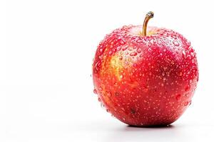 A red apple with water droplets on it photo
