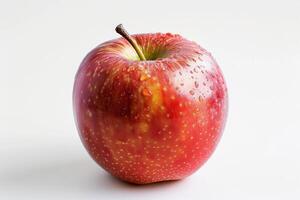 A red apple with water droplets on it photo