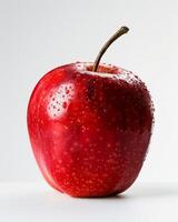 A red apple with water droplets on it photo