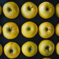 A bunch of apples arranged in a row photo