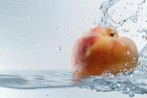 A peach is splashing in water with water drops photo