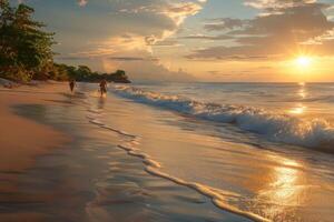 Golden sunset reflecting on waves and pebbles on sandy beach photo