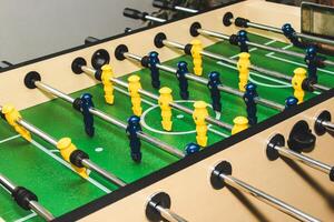 Table soccer. Game figures football players close up. An entertaining game for football fans. photo