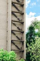 Abandoned empty city, multi-storey building. Empty rooms without windows. photo