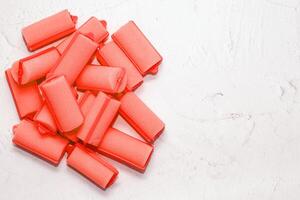 Soft foam comfortable hair curlers on a solid background photo