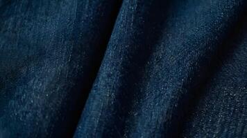 Closeup of Textured Dark Blue Denim Fabric photo