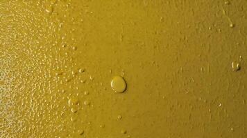 Closeup Texture of Glossy Yellow Enamel Surface photo