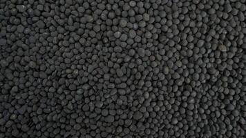 Black Pebbles Texture Background photo