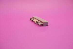 a set of screwdriver bits isolated on purple background photo
