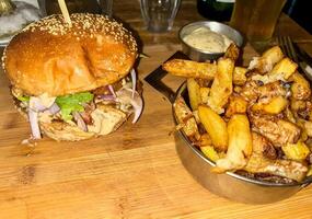 Delicious homemade burger with french fries photo