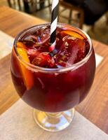 Fresh sangria with ice and orange slices photo