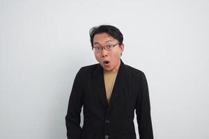 Asian Businessman with expression wow surprised in isolated white background photo