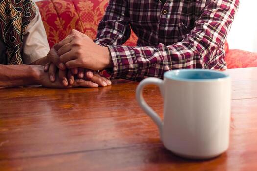 holding hand between son and father. Mental health, support and sharing, deep talking session photo