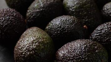 Avocado fruit, closeup of avocados fruit with drops video