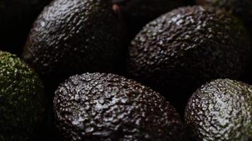 Avocado fruit, closeup of avocados fruit with drops video