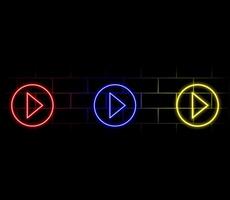 A set of neon arrows and pointers of different colors on the background of the wall. vector