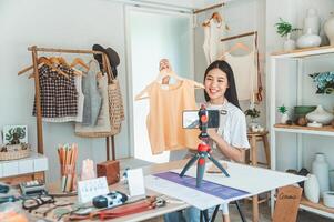 Small business owners are live streaming. Sell products to customers who come to see to buy and take orders. Check out the orders that customers order from online retailers - online shopping. photo