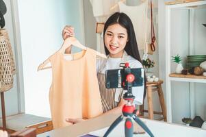 Small business owners are live streaming. Sell products to customers who come to see to buy and take orders. Check out the orders that customers order from online retailers - online shopping. photo
