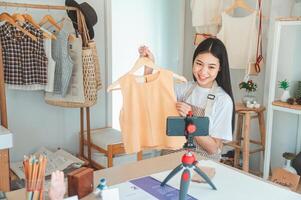 Small business owners are live streaming. Sell products to customers who come to see to buy and take orders. Check out the orders that customers order from online retailers - online shopping. photo