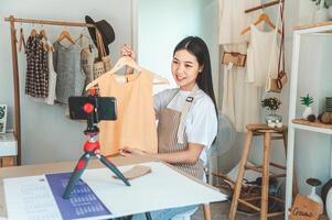 Small business owners are live streaming. Sell products to customers who come to see to buy and take orders. Check out the orders that customers order from online retailers - online shopping. photo