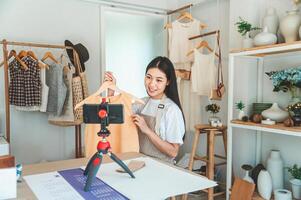 Small business owners are live streaming. Sell products to customers who come to see to buy and take orders. Check out the orders that customers order from online retailers - online shopping. photo
