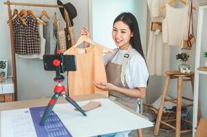 Small business owners are live streaming. Sell products to customers who come to see to buy and take orders. Check out the orders that customers order from online retailers - online shopping. photo