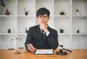 Law theme, mallet of the judge, law enforcement officers, evidence-based cases, and documents taken into account. photo