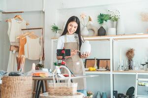 Small business owners are live streaming. Sell products to customers who come to see to buy and take orders. Check out the orders that customers order from online retailers - online shopping. photo