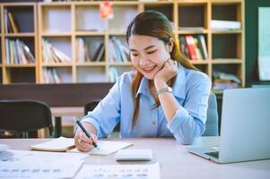 businessman pointing with pen on business report chart are working on accounts in business analysis with graphs and documentation. photo