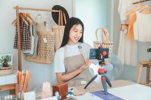 Small business owners are live streaming. Sell products to customers who come to see to buy and take orders. Check out the orders that customers order from online retailers - online shopping. photo