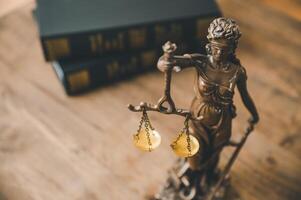 Lady justice,lady justice statue on table,Law theme, mallet of the judge, law enforcement officers, evidence-based cases and documents taken into account. photo