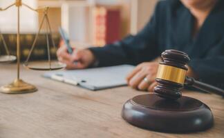 Law theme, mallet of the judge, law enforcement officers, evidence-based cases and documents taken into account. photo