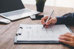 Individuals or recent grads looking for work and filling out a job application should first evaluate the application before applying for a position. photo