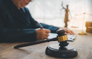 Law theme, mallet of the judge, law enforcement officers, evidence-based cases and documents taken into account. photo