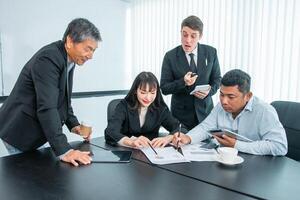 Business people team work while working in board room, design project, discussing ideas,discuss financial statistics together teamwork concept photo