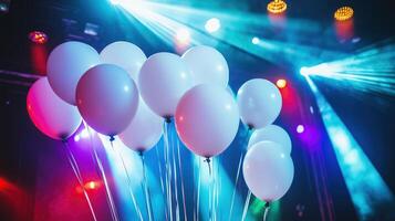 balloons illuminated by stage lights photo