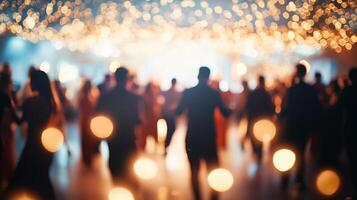 Blurred figures of people dancing in a hall photo