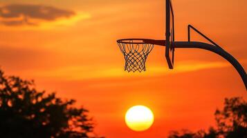 basketball hoop against the sunset. photo