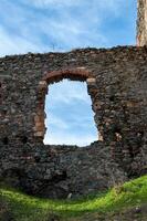 A wall with a window from the Soimos Fortress. Built in 1278 photo