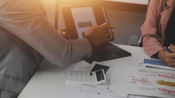 Close up of Business team analyzing income charts and graphs with modern laptop computer. Business analysis and strategy concept. photo
